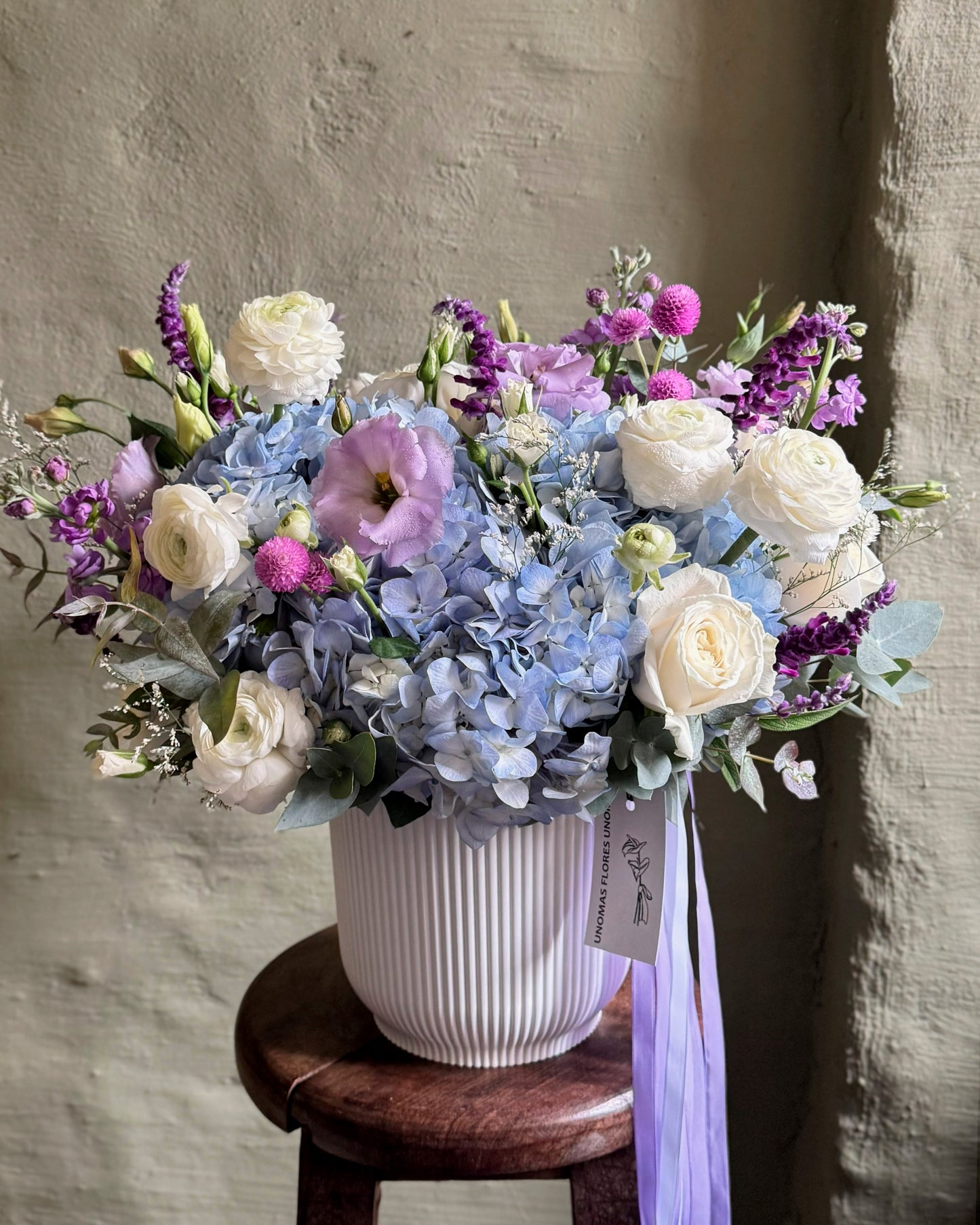 Floral arrangement gentle light blue with hortensias