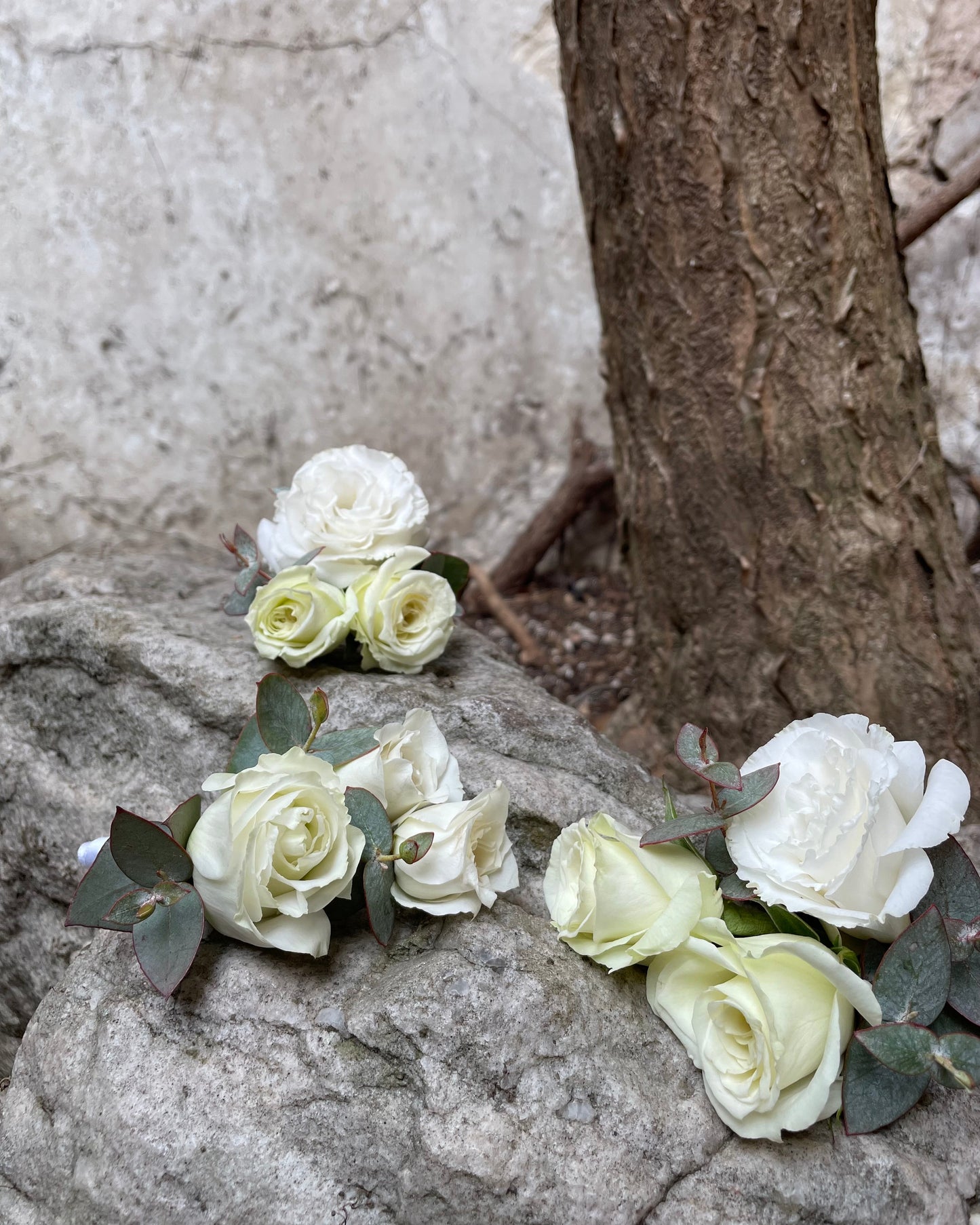 Bridal white bouquet with roses, ranunculus & lisianthus
