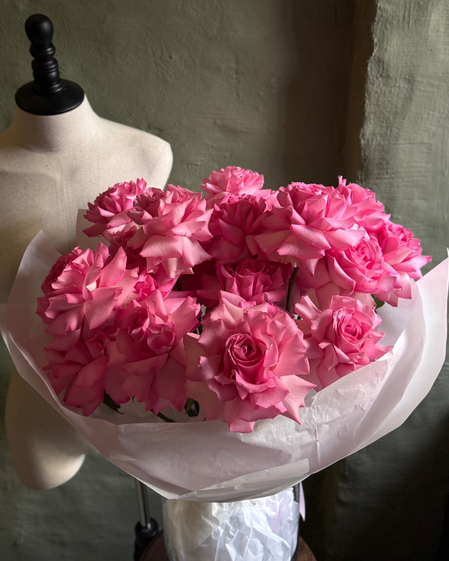 Hand-tied bright pink reflexed roses 21 pcs with a ribbon