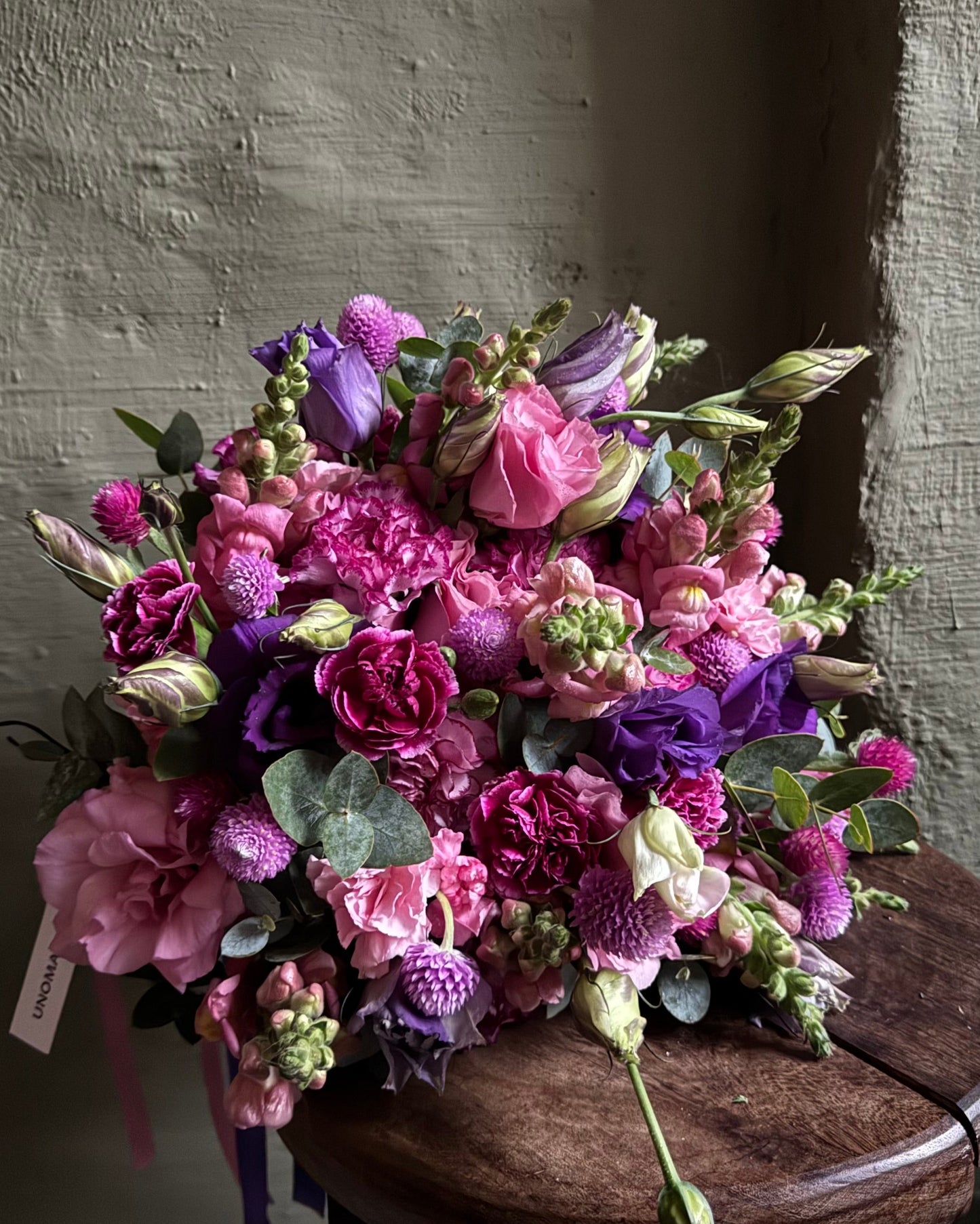 Hand-tied bright purple bouquet with carnations