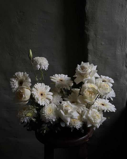 Bouquet of white flowers on a dark background