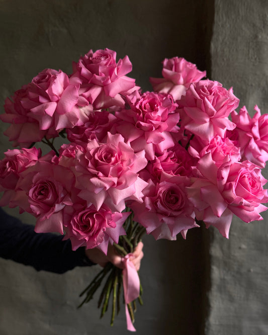 Hand-tied bright pink reflexed roses 21 pcs with a ribbon