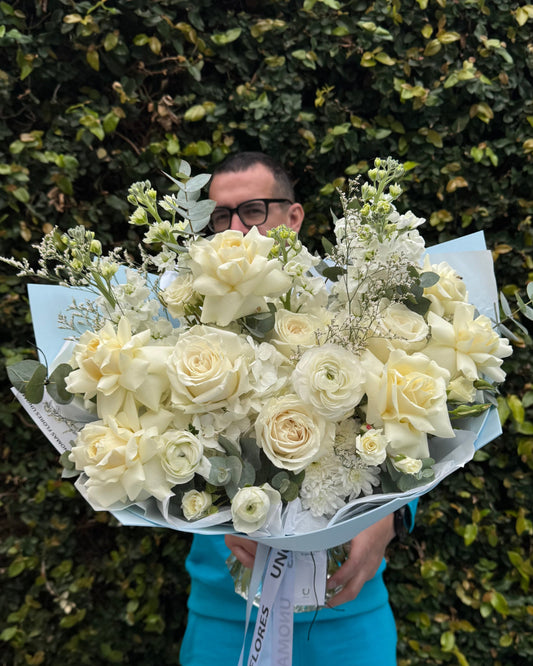White mixed flower bouquet wrapped in light blue foamiran