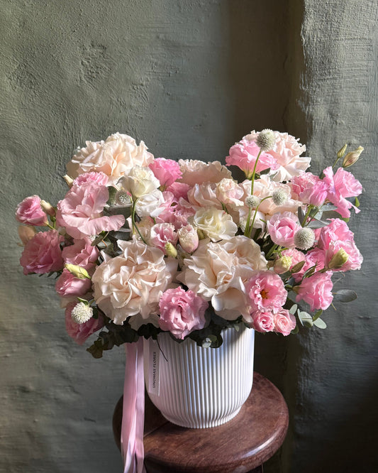 Floral arrangement gentle pink & cream in a cachepot