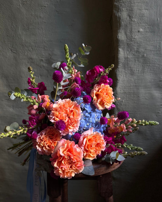 Hand-tied bright colorful mixed flower bouquet
