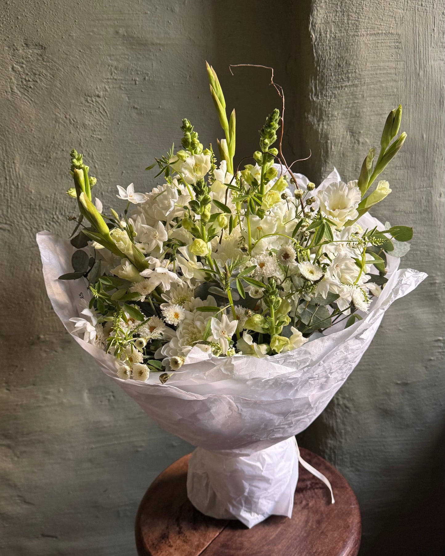 Field style bouquet with daffodils, antirrhinums, gladioli