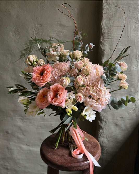 Pastel peach interior mixed flower bouquet